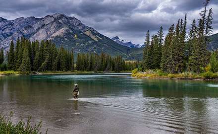An angler is fishing outdoors