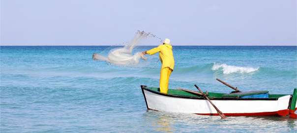 a fisherman is fishing on the sea
