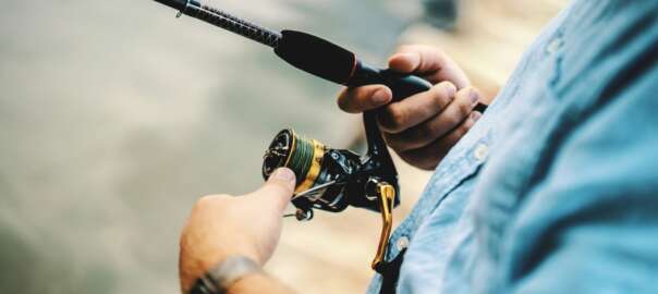 a man is using a fly rod