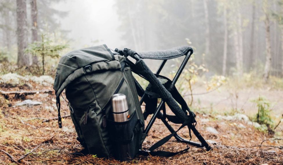 a a backpack and a chair ready for turkey hunting