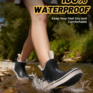 Woman walking in water wearing Kalkal waterproof women’s deck boots
