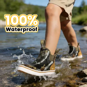 a little kid is wearing Kalkal deck boots, walking through the stream